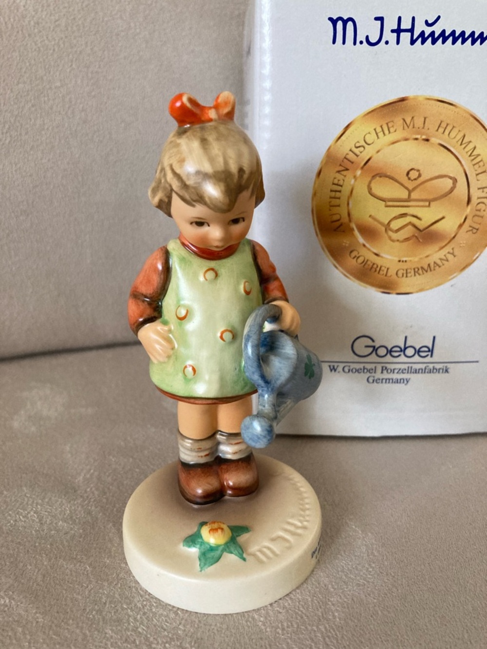 Goebel Hummel figurine. Girl with watering can.